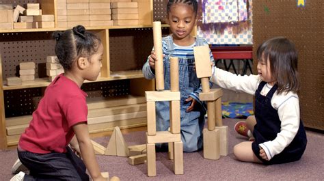 Cooperative Play Examples · Young children helping each other put together a puzzle. . Cooperative play examples for toddlers